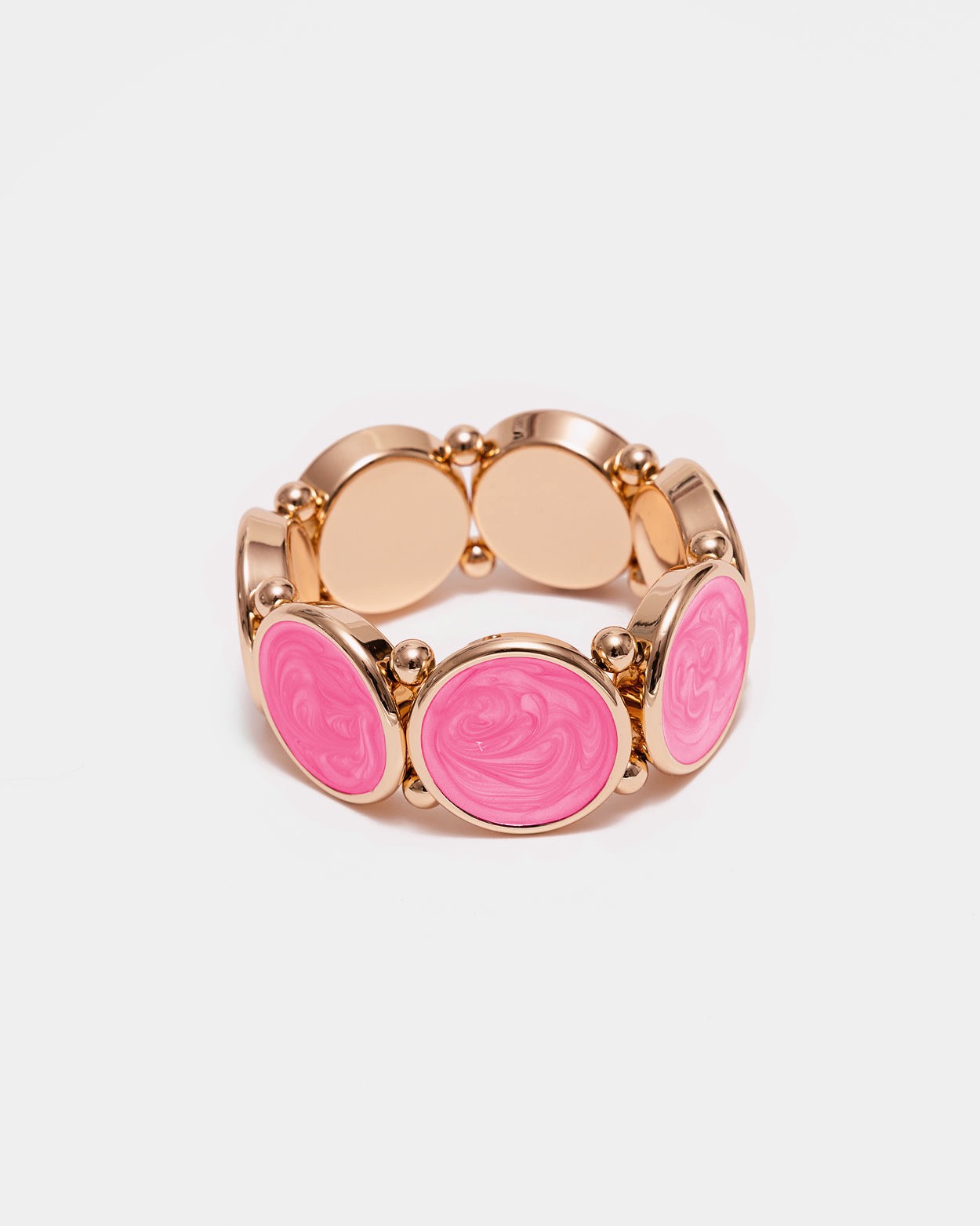Elastiskt armband med runda plattor som har en guldkant i Pink