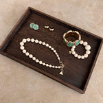 Dark Wood Tray with jewelries
